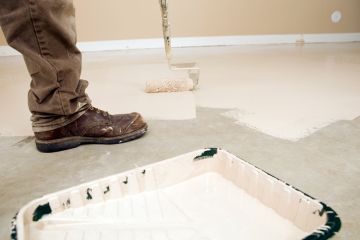 Painter painting garage floor in Mount Holly